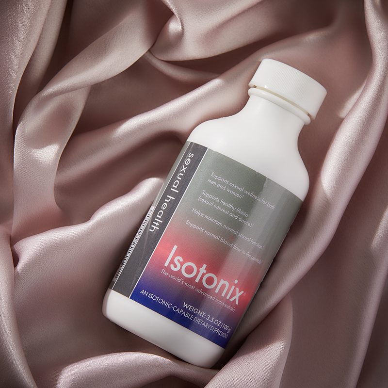 Bottle of Isotonix Sexual Health lying on a silk cloth