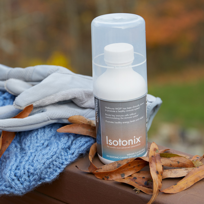 Isotonix Immune, 30 Servings bottle, with gloves, a blue scarf and leaves