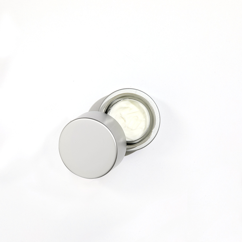 Cellular Laboratories De-Aging Eye Creme, with cap open showing creamy white product.