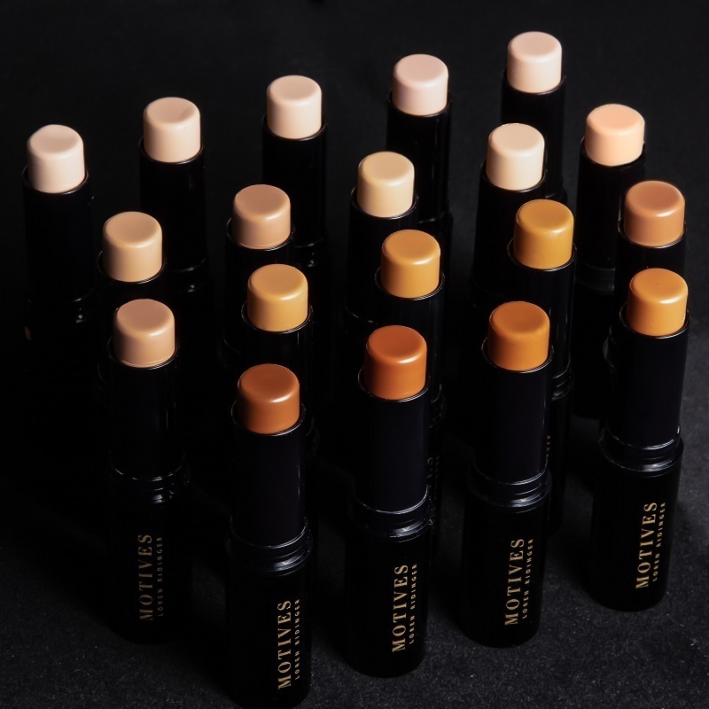 Motives Flawless Face Bundles, of Flawless Face Stick Foundations, standing on end with open tops showing foundation shades