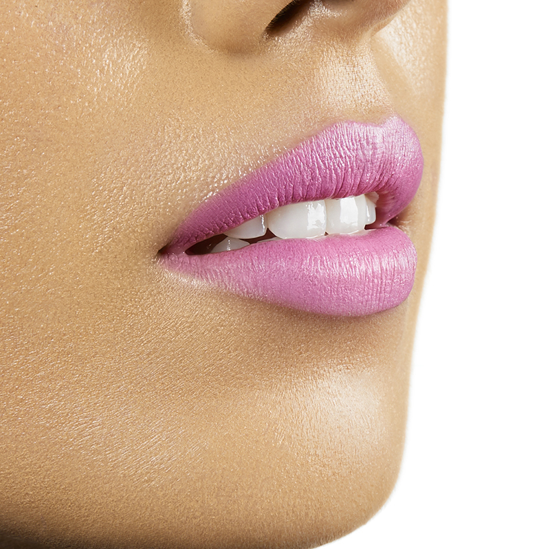 Closeup on lips of model with medium skin tone wearing Motives Cream Lipstick, color Baddie, side view