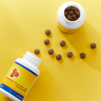 MPC Maximum Prostate Care, with caplets laid out on a yellow table 