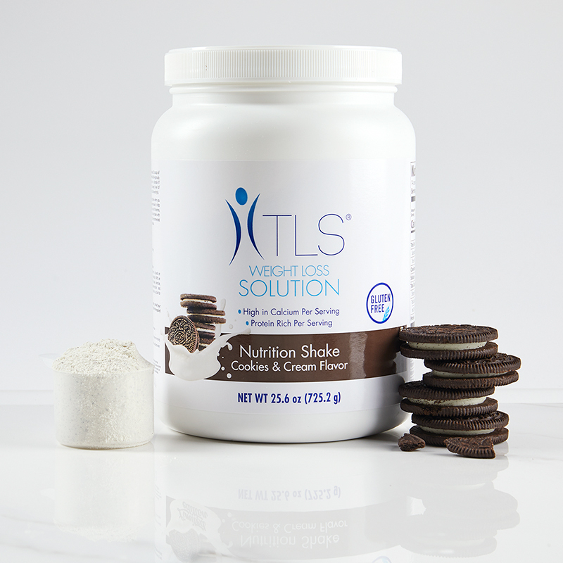 TLS Nutrition Shakes - Cookies & Cream, with serving scoop filled with powder product and chocolate cookies stacked to the right