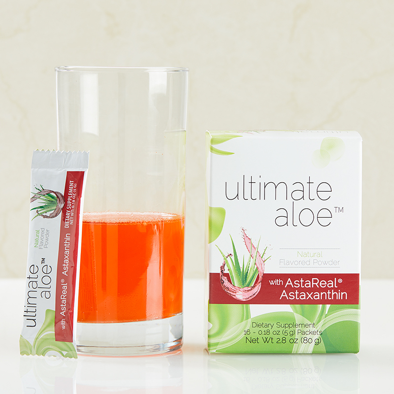 Ultimate Aloe with AstaReal Astaxanthin, with half filled glass and packet