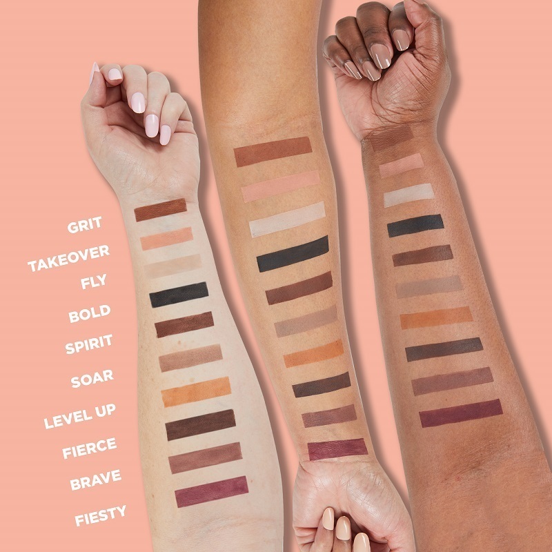 Motives Super Power Mattes Eye Shadow Palette, shown as stripes of colors on three models' arms of light, medium and dark skin tones