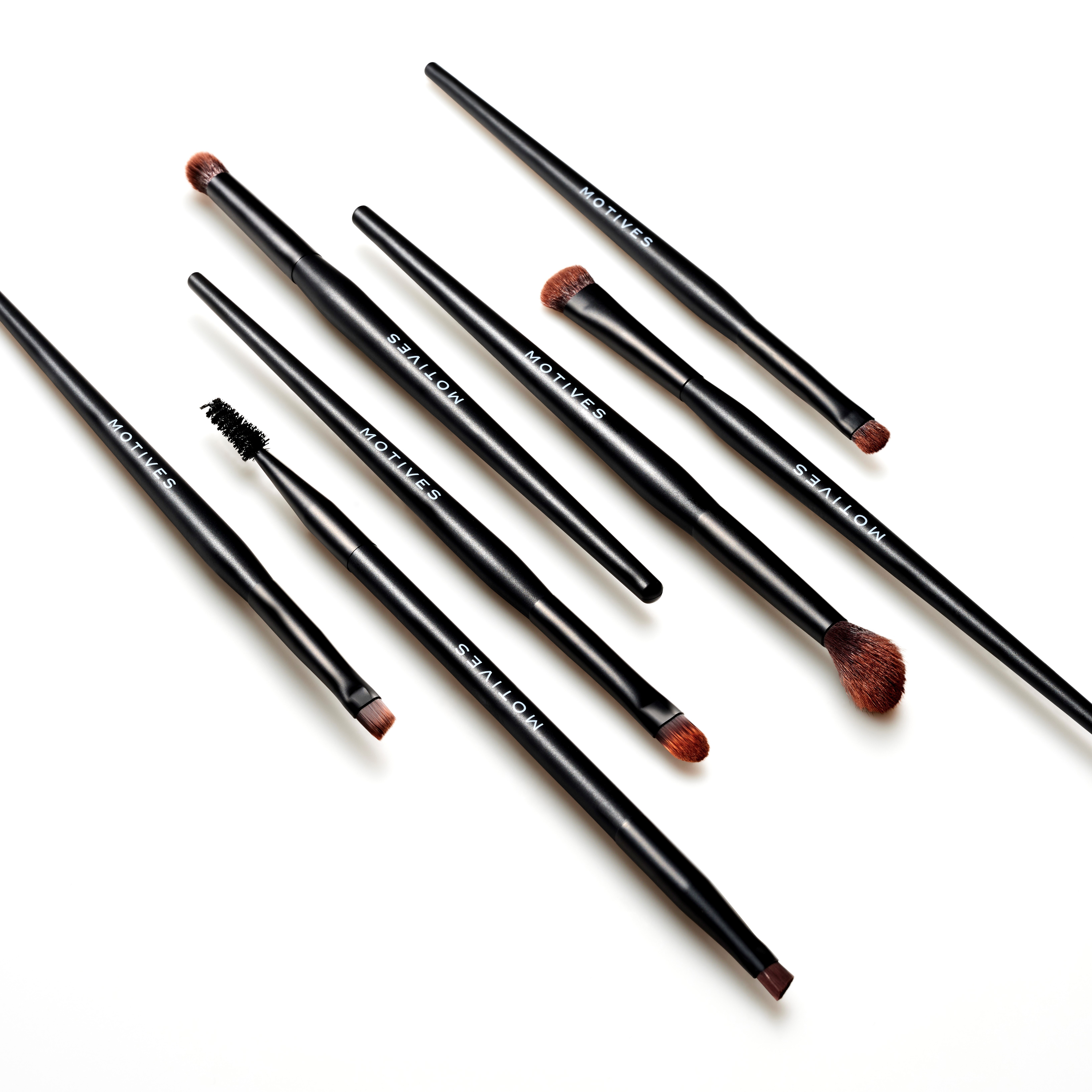 Motives Essential Eye 7-Piece Brush Set displayed at an angle on a white background.