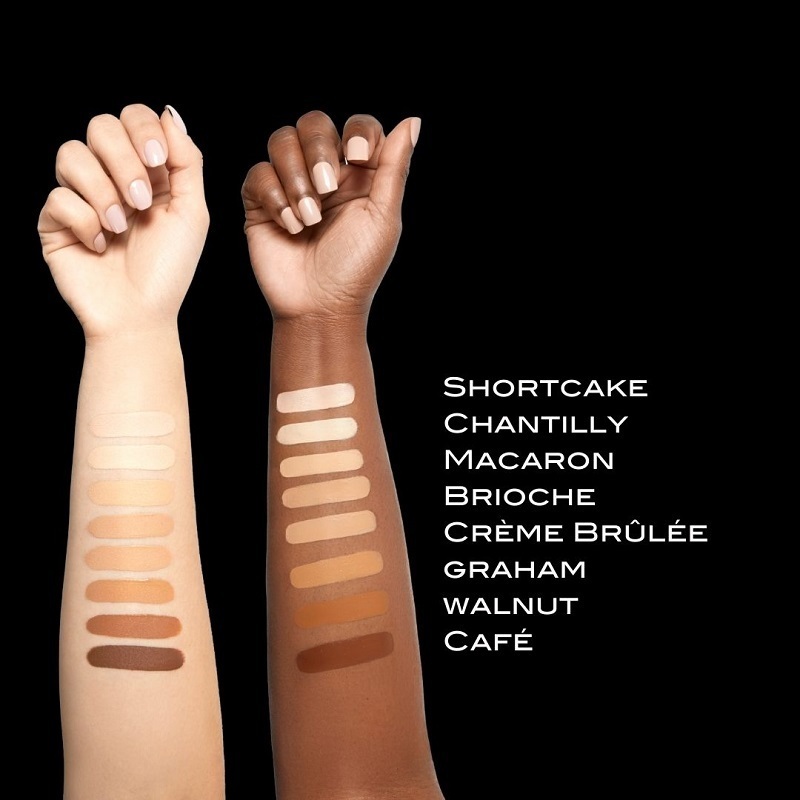 Motives Sculpting Concealer shades swatched on two models' arms of light and dark skin tones, for closest match.