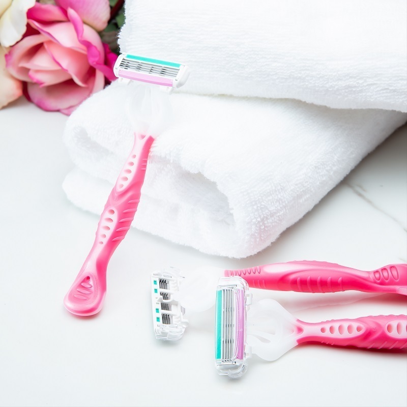 Shopping Annuity Brand Performance Razors Disposable Pack for Women shown with white folded towels and a rose
