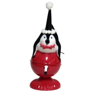 10.5 Playful Glittered Black and White Penquin Laying on Large Red Jingle Bell Christmas Table Top Decoration - All