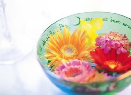 Panoramic Images PPI117892 Pink orange and yellow flowers floating in a blue bowl Poster Print by Panoramic Images - 36 x 27 