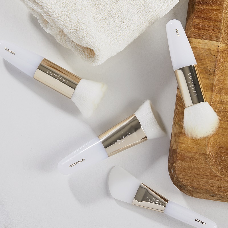 Lumière de Vie Skincare Brush Collection, with a wooden tray and a folded towel