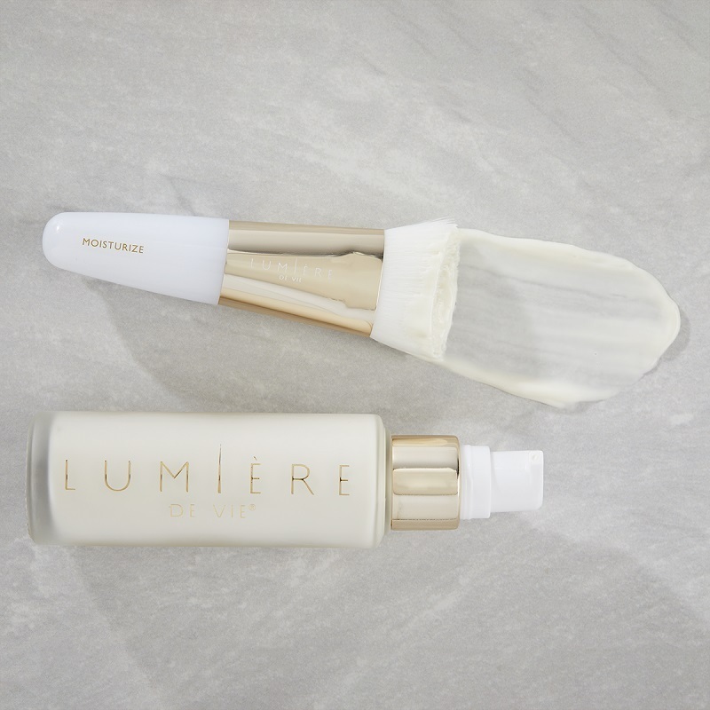 Lumière de Vie Skincare Brush Collection, Moisturizer brush pictured with Lumiere de Vie Moisturizing product