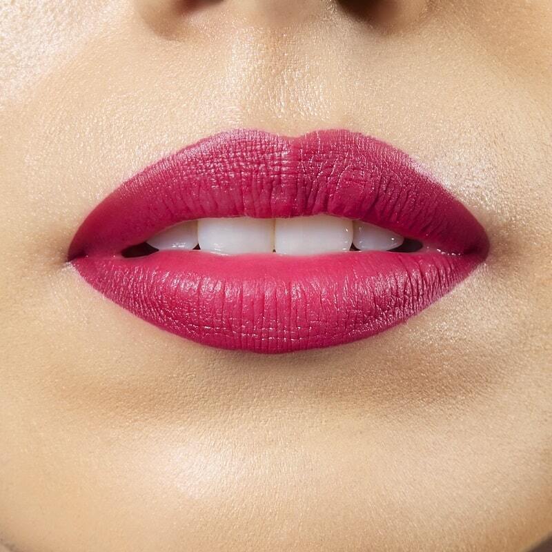 Closeup on lips of model with medium skin tone wearing Motives Lip Kit, color Déjà Vu