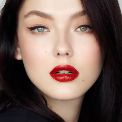 Model front facing showing Motives Precisely The Point Eye Line, with completed Motives makeup