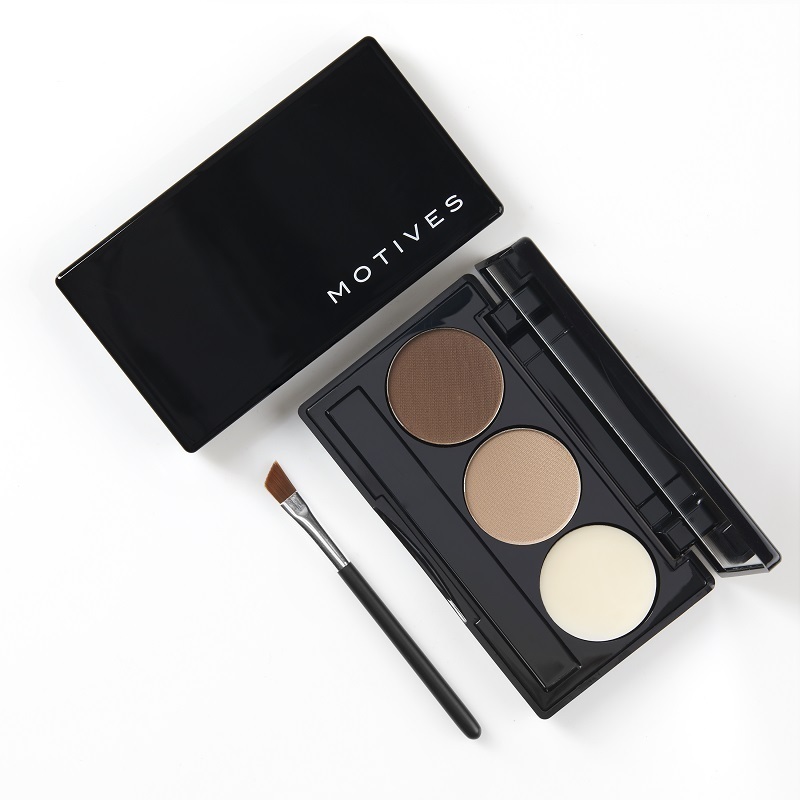 Motives Essential Brow Kit opened palette, showing 2 brow powders and 1 brow wax, with applicator brush
