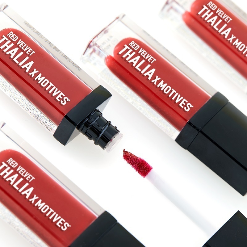 Four THALIA X Motives Liquid Lipstick in Red Velvet, one tube open showing sponge applicator