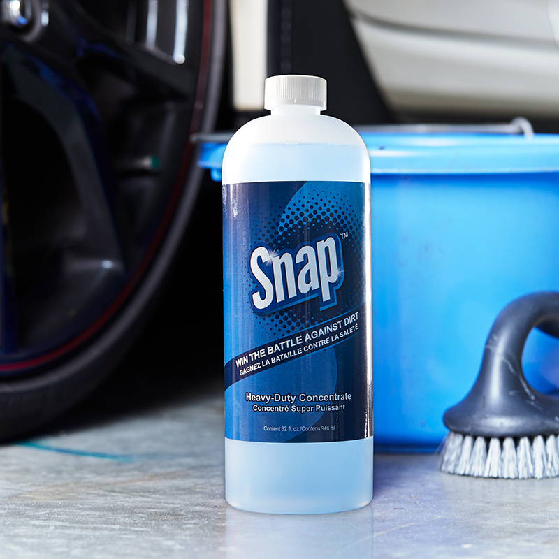 Snap Heavy Duty Concentrate bottle. next to a blue toilet and scrub brush