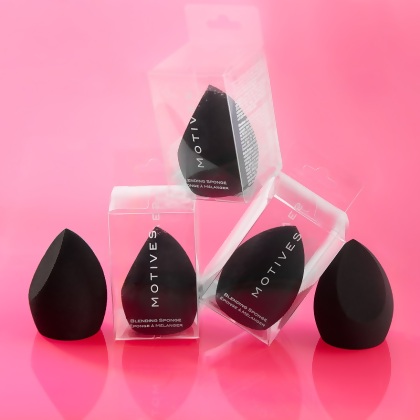 Five stacked black Motives Blending Sponges, three in box and two out of box illustrated