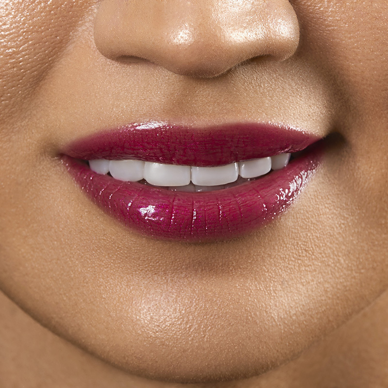 Motives Liquid Lip Glaze, color My Type, closeup on lips of model with medium skin tone