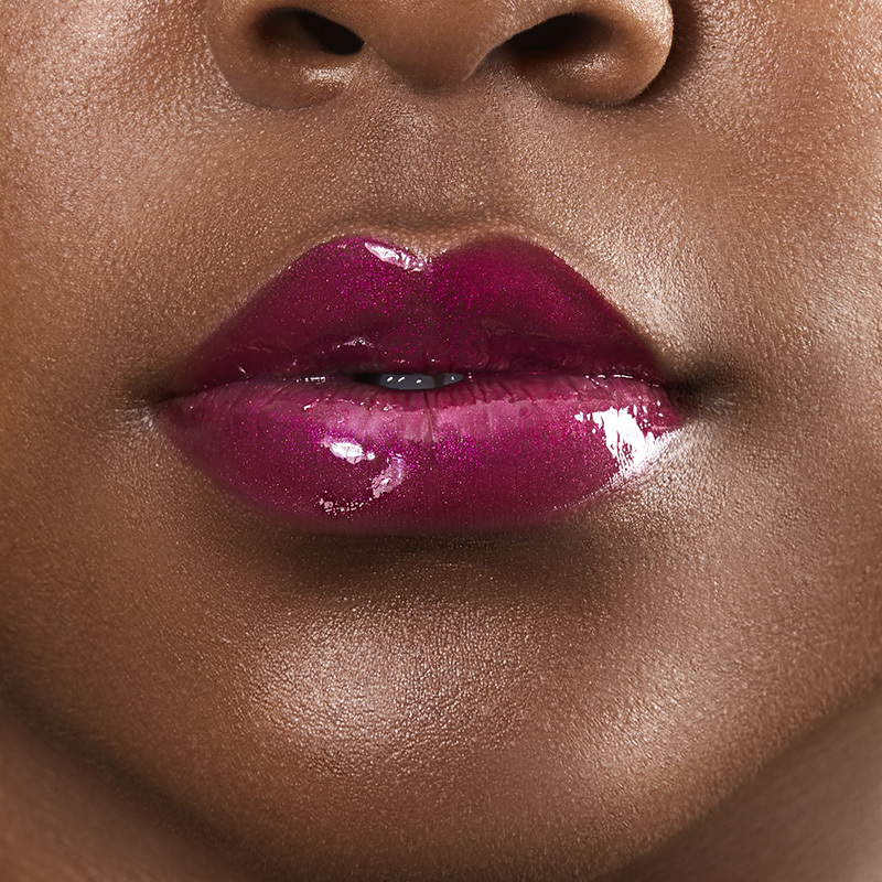 Motives Liquid Lip Glaze, color My Type, closeup on lips of model with dark skin tone