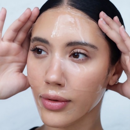 A woman wearing the Lumière de Vie Soothe & Renew Hydrogel Masque.