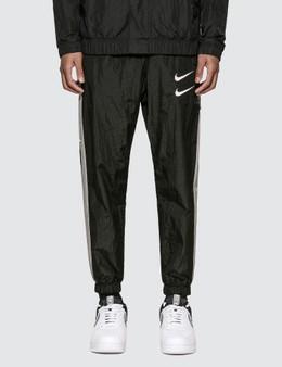 nike swoosh woven pants