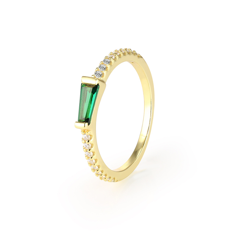 Closeup of Layered Zoe - Tapered Baguette Pave Ring gold with green gem