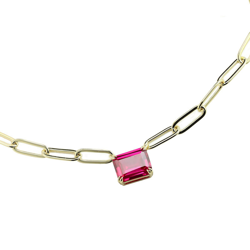 Closeup of Layered SCARLETT - Petite Solitaire Paperclip Necklace, gold with pink gem