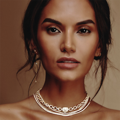 Model wearing multiple Layered Hailey - Round Cut Tennis Necklaces and Loren - Pave Square Radiant Cut Link Necklace