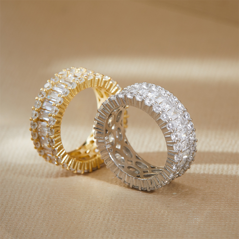 Closeup of Layered MICHAEL - Mixed Cut Eternity Bands, one in silver and one in gold