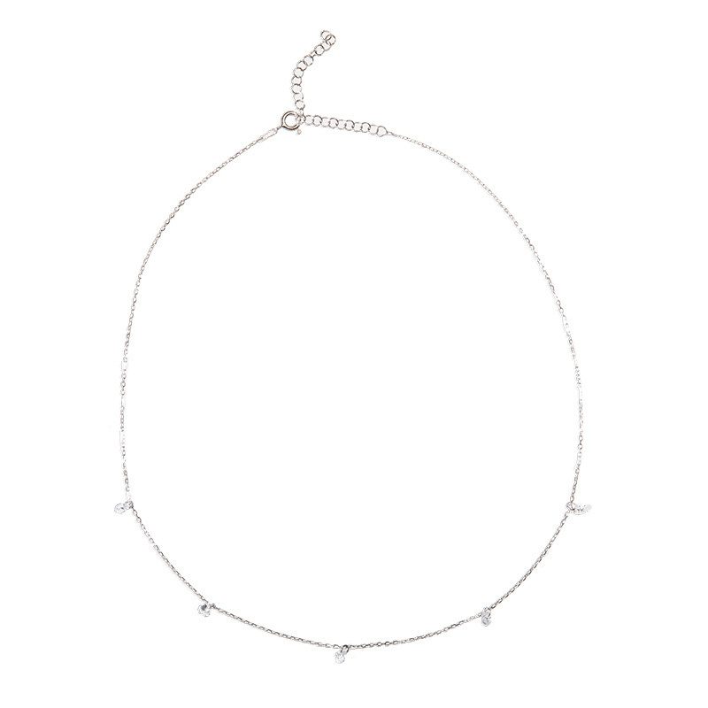 Closeup of Layered DESI - Pierced Round Cut Necklace in silver
