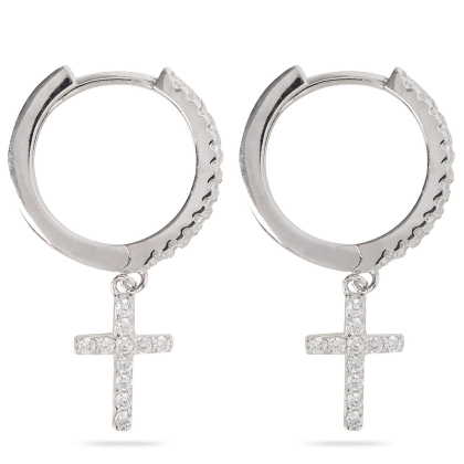 Closeup of Layered Brandi - Cross Huggie Earrings in silver, side view