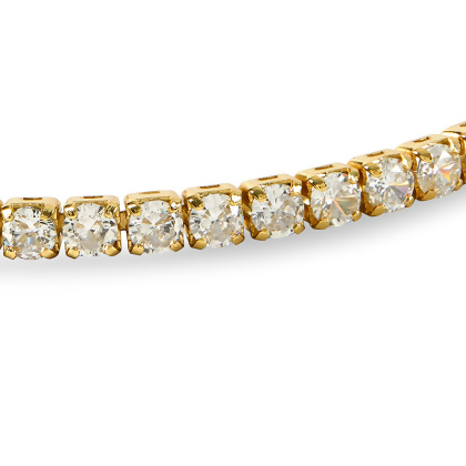 Closeup of Layered VIOLET - Round Cut Tennis Bracelet in gold with clear gems