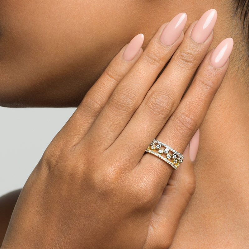 Model wearing two Layered PRIYA Crown Rings together, in silver