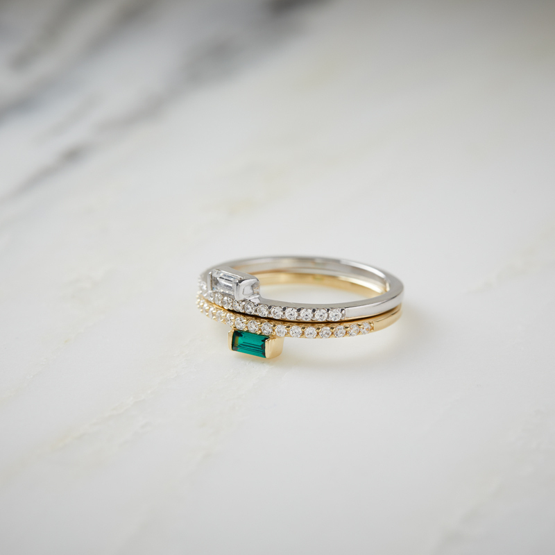 Two Layered Celia - Baguette Rings With Sparkle, in gold with green gem, and silver with clear gem, stacked