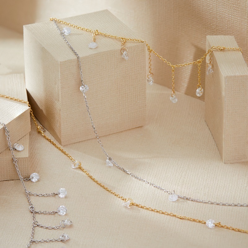 Closeup Closeup of LAYERED Desi - Pierced Round Cut Necklace and Ana - Pierced Round Cut Drop Choker in Gold and silver