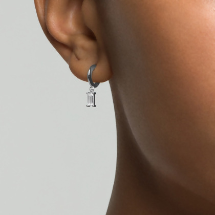 Model wearing Layered INA Baguette Hoop Earrings in silver with clear gems