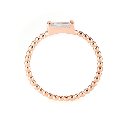 Closeup of Layered Adrienne - Spiraled Baguette Ring, Rose Gold with clear gem, edge view