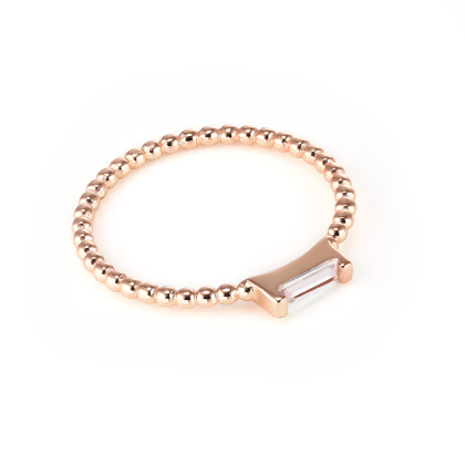Closeup of Layered Adrienne - Spiraled Baguette Ring, Rose Gold with clear gem, top-down angled view