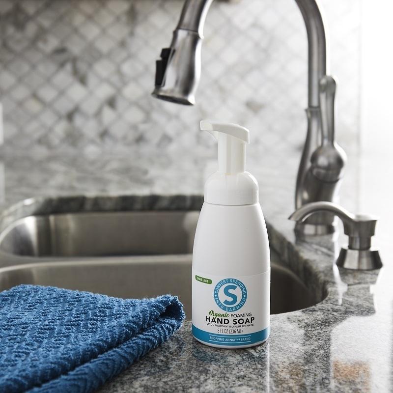 Shopping Annuity Brand Organic Foaming Hand Soap on a sink beside a blue towel