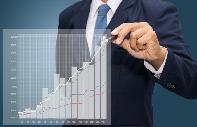 Business man drawing a graph