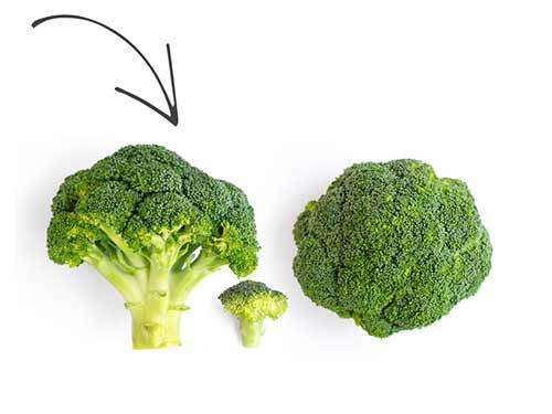 Arrow pointing to three heads of broccoli.
