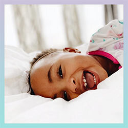 Kid laying in bed