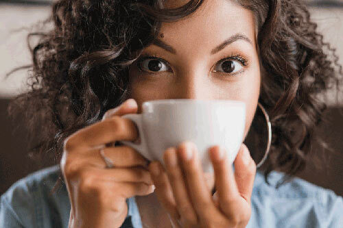Women sipping drink