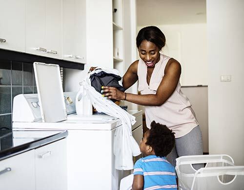 Mom and kid doing laundry