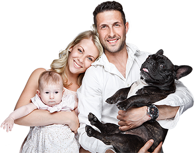 Family all smiling together with a baby and dog.